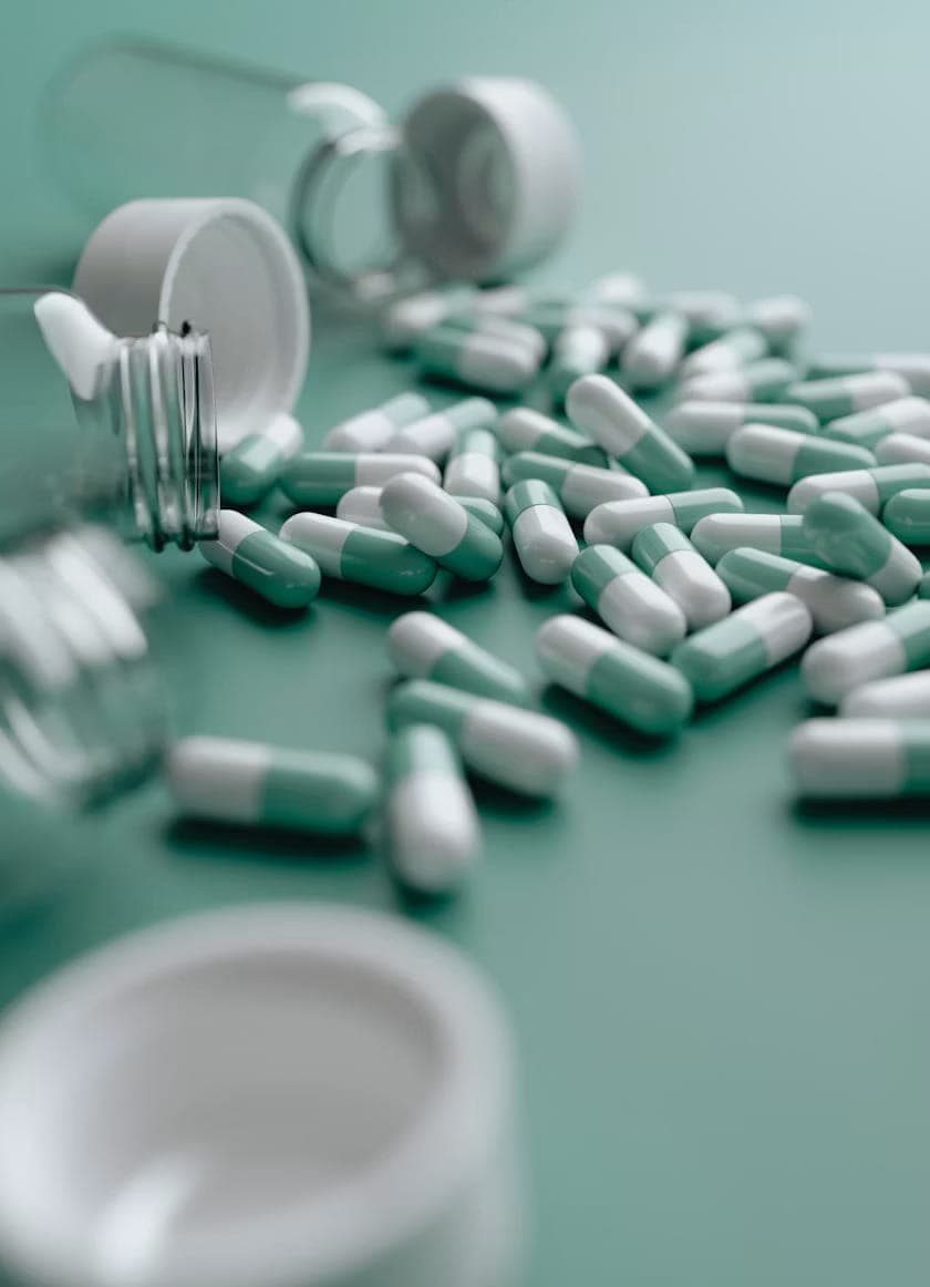 Blister pack and analgesic tablets on a clean clinical surface